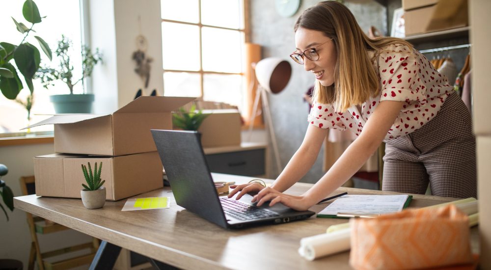 A Female Gig Economy Worker Using A Laptop. Gig Workers Can Use Small Business Accounting And Tax Prep Services.